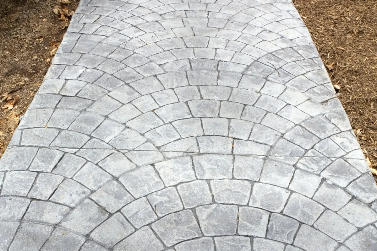 Stamped cobblestone-pattern concrete walkway NC Foothills — The Foothills Concrete Company